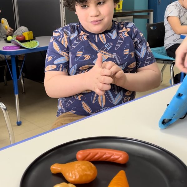 Male student working on food choices in HH school